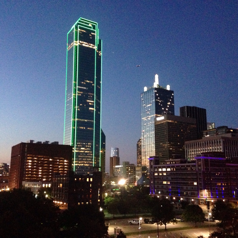 An image of the downtown Dallas skyline at dusk