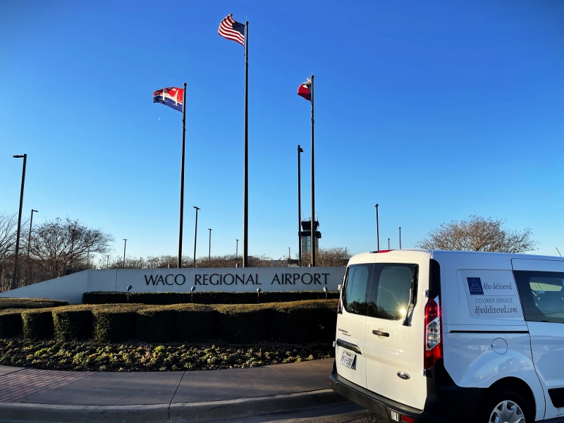 A courier van at Waco airport for delivery service