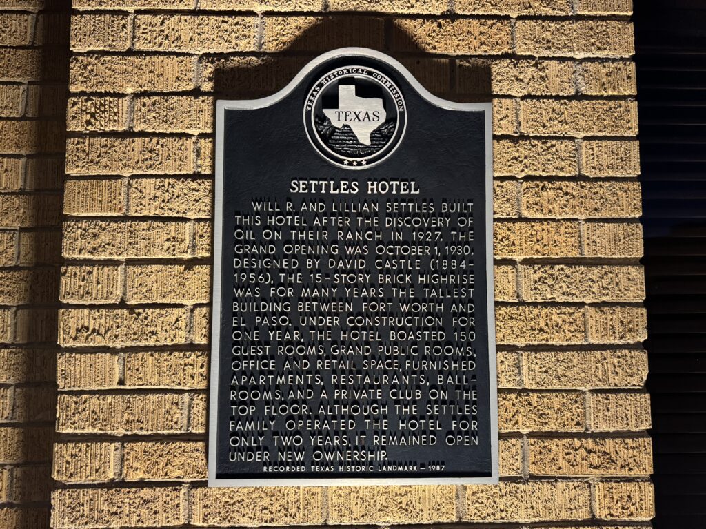 The historical marker in front of the Hotel Settles.